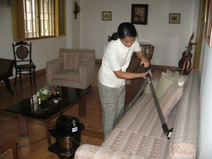 HOUSEKEEPING_(using_vacuum_cleaner)